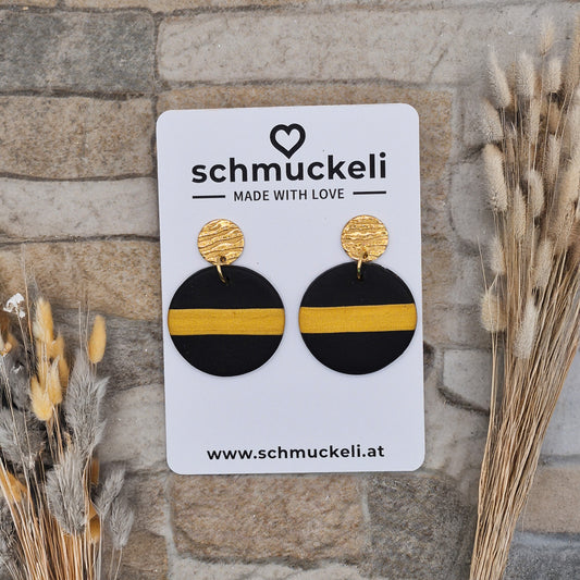 Glanzstreif - schwarze runde Ohrringe aus Polymer Ton mit einem goldenen Streifen