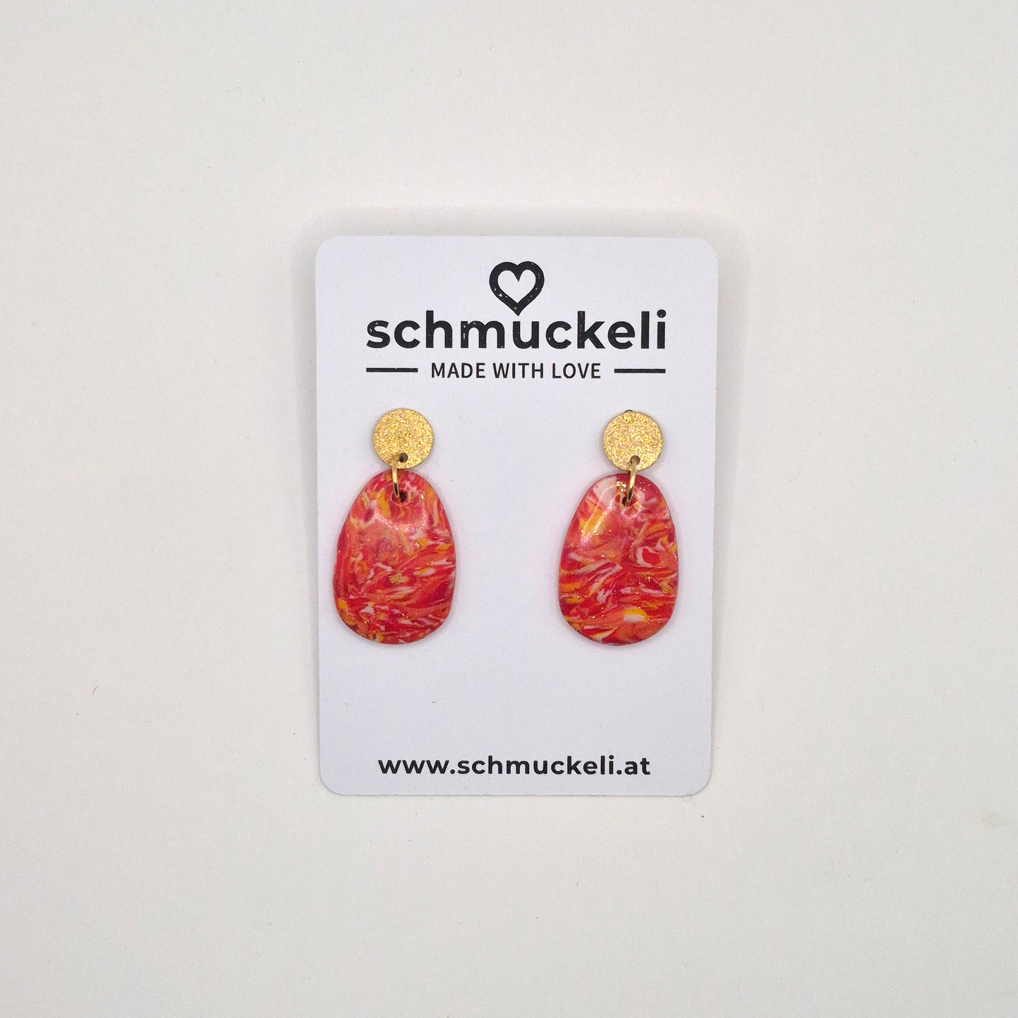 Sonnenfunkeln – Rote Statement-Ohrringe mit Goldakzenten