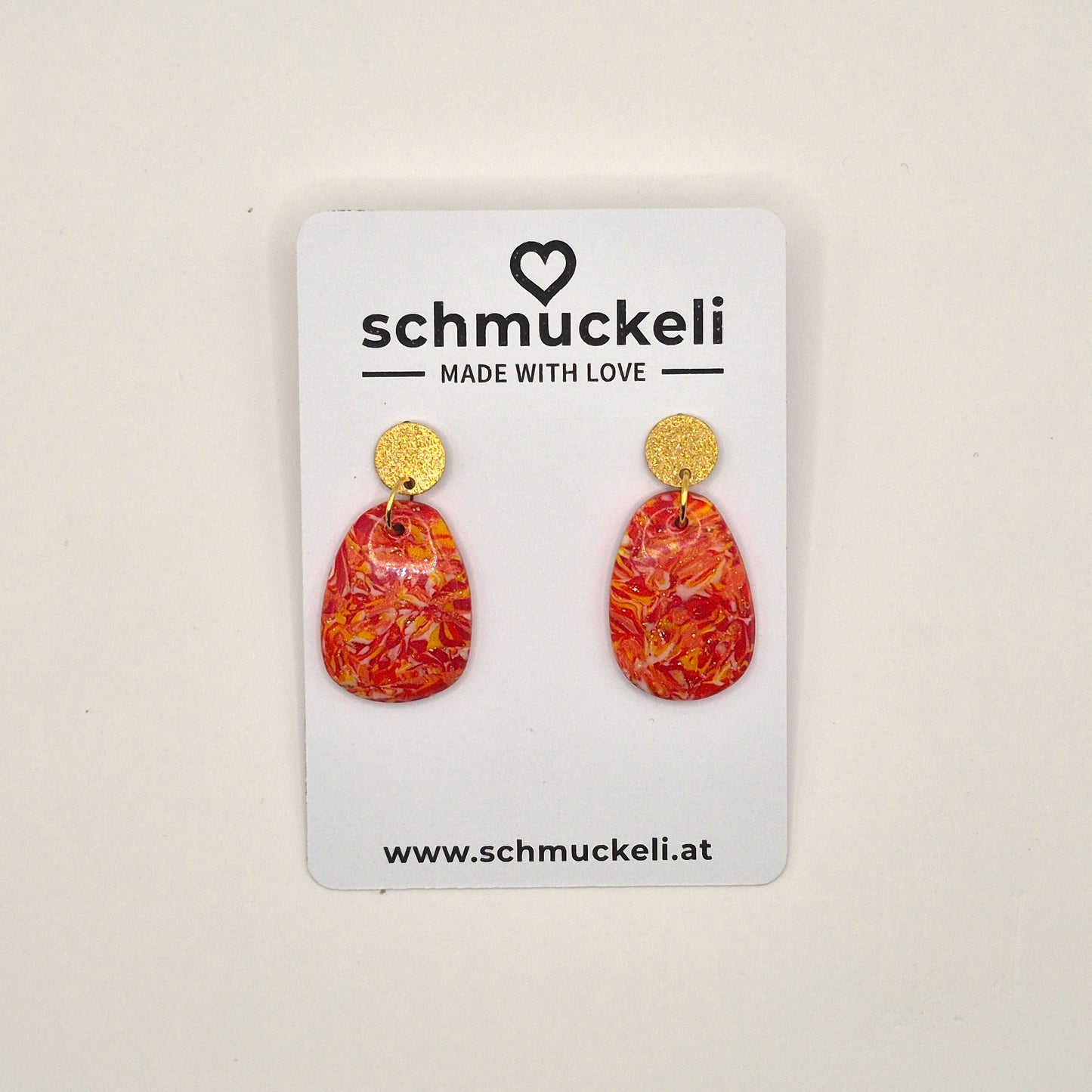 Sonnenfunkeln – Rote Statement-Ohrringe mit Goldakzenten