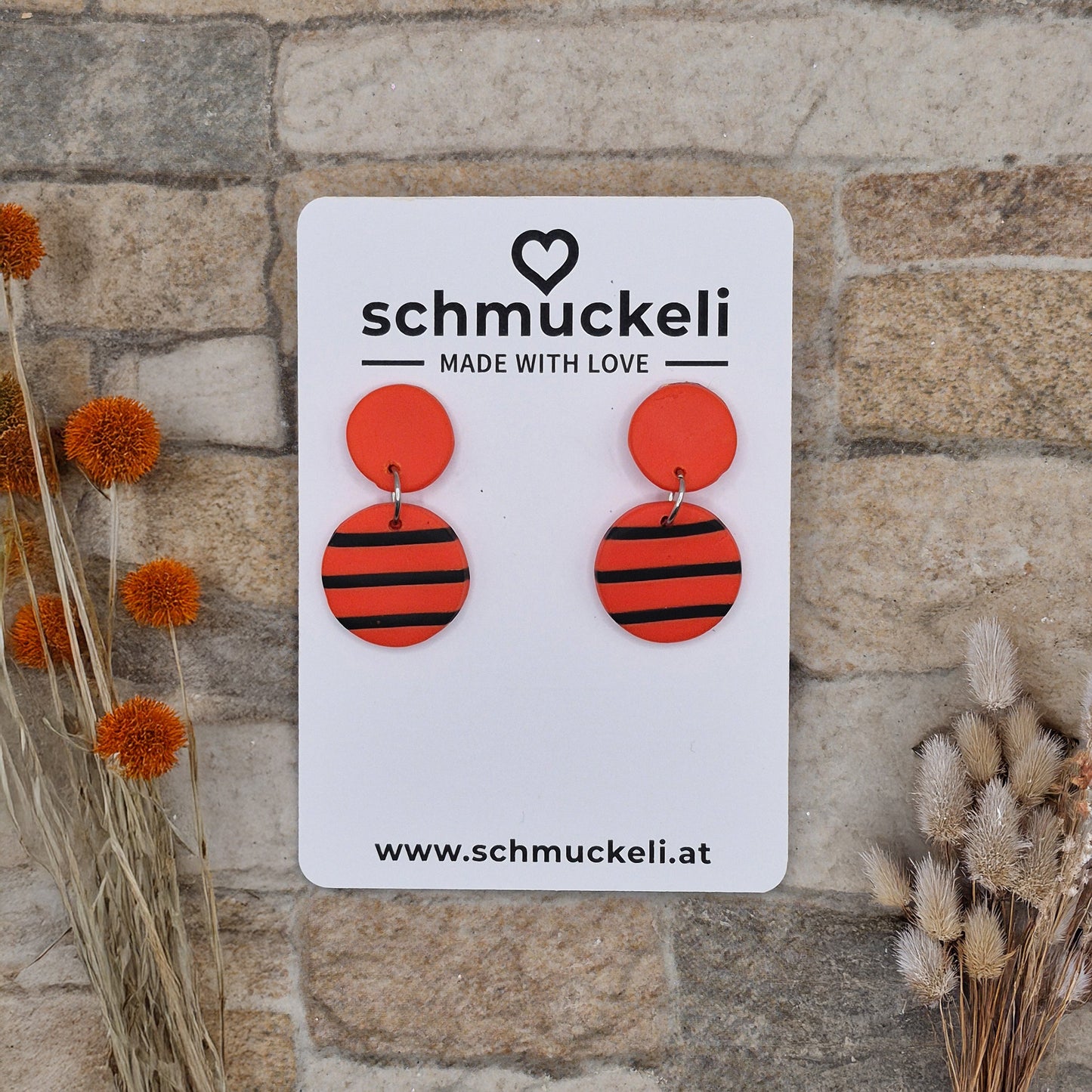 Glutwind - zweiteilige orange Ohrringe aus Polymer Ton mit schwarzen Streifen